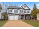 Beautiful two-story home with a two-car garage and well-maintained landscaping at 1010 Coleman Place Dr, Roswell, GA 30075