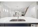 Bright kitchen view featuring a large central island and the main living area in the background at 1010 Coleman Place Dr, Roswell, GA 30075