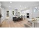 Modern kitchen with stainless steel appliances, dark island, breakfast bar, and plenty of cabinet space at 1010 Coleman Place Dr, Roswell, GA 30075