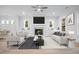 Bright and airy living room featuring a fireplace and ample seating at 1010 Coleman Place Dr, Roswell, GA 30075