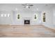 Bright living room features a cozy fireplace, built-in cabinets, and hardwood floors at 1010 Coleman Place Dr, Roswell, GA 30075