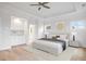 Serene bedroom with built-ins, hardwood floors, and plenty of natural light at 1010 Coleman Place Dr, Roswell, GA 30075