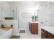 Modern bathroom with a soaking tub, marble accents, and separate glass shower at 204 Phillips Ln, Alpharetta, GA 30009