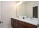 Bathroom with double sinks, a large mirror and a full bath for ultimate convenience at 204 Phillips Ln, Alpharetta, GA 30009