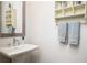Charming bathroom with pedestal sink, decorative mirror and shelving at 204 Phillips Ln, Alpharetta, GA 30009
