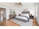 Bright bedroom featuring a ceiling fan, grey accent wall, and lots of natural light from two windows at 204 Phillips Ln, Alpharetta, GA 30009