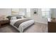 Bright bedroom featuring a plush bed, neutral decor, and natural light from the two large windows at 204 Phillips Ln, Alpharetta, GA 30009