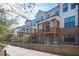 Exterior rear view featuring a brick foundation and covered porches at 204 Phillips Ln, Alpharetta, GA 30009