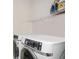 Convenient laundry room with modern front loading washer and dryer at 204 Phillips Ln, Alpharetta, GA 30009