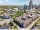 Aerial view highlights the apartment complex, landscaping, nearby buildings, and golf course at 400 17Th Nw St # 2029, Atlanta, GA 30363