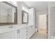 Spacious primary bathroom featuring dual sinks, large mirrors, and a tiled floor at 400 17Th Nw St # 2029, Atlanta, GA 30363