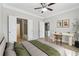 Cozy bedroom with a ceiling fan, desk and glimpses into the bathroom and kitchen at 400 17Th Nw St # 2029, Atlanta, GA 30363