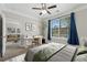 Comfortable bedroom featuring a large window, desk, and glimpses into the living room at 400 17Th Nw St # 2029, Atlanta, GA 30363