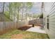 The cozy backyard features a small patio area with a wood fence at 540 Broughton Dr, Canton, GA 30114