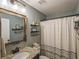 This bathroom features a shower, decorative shelves, and a granite countertop at 540 Broughton Dr, Canton, GA 30114