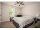 Bedroom with a bed, a desk, an office chair, a small window, and a bureau at 540 Broughton Dr, Canton, GA 30114