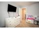 Bedroom featuring white dresser, a doorway, and a toy kitchen at 540 Broughton Dr, Canton, GA 30114