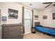 A secondary bedroom with a bed, bureau, window with blinds, and a ceiling fan at 540 Broughton Dr, Canton, GA 30114