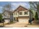 Two-story home with shutters, a two-car garage, and a neatly maintained lawn and landscaping at 540 Broughton Dr, Canton, GA 30114