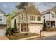 Charming two-story home with neat landscaping, shutters and a two-car garage at 540 Broughton Dr, Canton, GA 30114