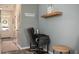This home office area with a floating shelf is conveniently located near the entry door at 540 Broughton Dr, Canton, GA 30114