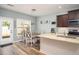 Well-lit kitchen featuring granite countertops, stainless steel appliances, and a dining area at 540 Broughton Dr, Canton, GA 30114