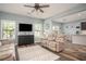 Cozy living room featuring wood floors, comfortable seating, and an open layout at 540 Broughton Dr, Canton, GA 30114