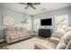 Comfortable living room featuring wood floors, comfortable seating, and stylish decor at 540 Broughton Dr, Canton, GA 30114