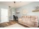 Inviting living room featuring wood floors, comfortable seating, and wall decorations at 540 Broughton Dr, Canton, GA 30114