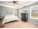 Main bedroom filled with natural light from the windows and neutral tones throughout at 540 Broughton Dr, Canton, GA 30114