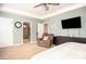 Main bedroom features a TV, dresser, recliner chair, and access to bathroom at 540 Broughton Dr, Canton, GA 30114