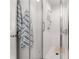 Modern bathroom featuring a glass enclosed shower with white subway tile and coordinating striped towels at 201 W Ponce De Leon Ave # 303, Decatur, GA 30030
