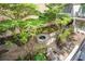 Charming courtyard with lush greenery, a stone fountain, and a tranquil ambiance at 201 W Ponce De Leon Ave # 303, Decatur, GA 30030