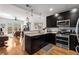 Contemporary kitchen featuring dark wood cabinets, stainless appliances, and granite countertops at 201 W Ponce De Leon Ave # 303, Decatur, GA 30030