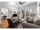 Inviting living room featuring bright windows and hardwood flooring adjacent to a bedroom and balcony at 201 W Ponce De Leon Ave # 303, Decatur, GA 30030