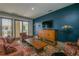 Comfortable lounge area with stylish seating, a large television, and access to outdoor amenities at 201 W Ponce De Leon Ave # 303, Decatur, GA 30030