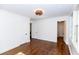Spacious bedroom featuring hardwood flooring, white walls, and a stylish ceiling light at 2010 Bixby Se St, Atlanta, GA 30317