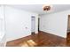 A bedroom featuring hardwood floors, white walls, doors and closet, with natural light at 2010 Bixby Se St, Atlanta, GA 30317