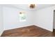 Bright bedroom featuring hardwood floors, white walls, and a window providing natural light at 2010 Bixby Se St, Atlanta, GA 30317