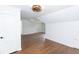 Large bedroom featuring hardwood flooring, white walls and trim, and updated lighting at 2010 Bixby Se St, Atlanta, GA 30317
