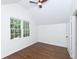 Bright bedroom with a vaulted ceiling, hardwood floors, and natural light at 2010 Bixby Se St, Atlanta, GA 30317