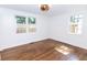 Bright, sun-filled bedroom showcasing hardwood floors and neutral walls with two windows at 2010 Bixby Se St, Atlanta, GA 30317