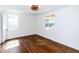 Bright bedroom with hardwood floors, neutral walls, a ceiling fan and two windows at 2010 Bixby Se St, Atlanta, GA 30317