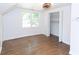 Bright bedroom featuring hardwood floors, closet and a ceiling fan with neutral walls at 2010 Bixby Se St, Atlanta, GA 30317