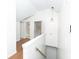 Hallway featuring hardwood floors, neutral walls and access to various rooms at 2010 Bixby Se St, Atlanta, GA 30317