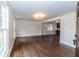 Open living room with hardwood floors, and clear view into the well lit modern kitchen at 2010 Bixby Se St, Atlanta, GA 30317