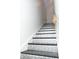 Detailed staircase featuring decorative metal treads, hand rail and white walls at 2010 Bixby Se St, Atlanta, GA 30317
