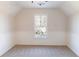 Cozy bedroom featuring neutral walls, white wainscoting and a large window at 288 Pine Way, Dallas, GA 30157