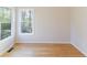Bright bedroom featuring bamboo floors, base trim, and natural light from windows at 288 Pine Way, Dallas, GA 30157