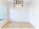 Dining area featuring bamboo flooring, modern lighting, and a bright window at 288 Pine Way, Dallas, GA 30157